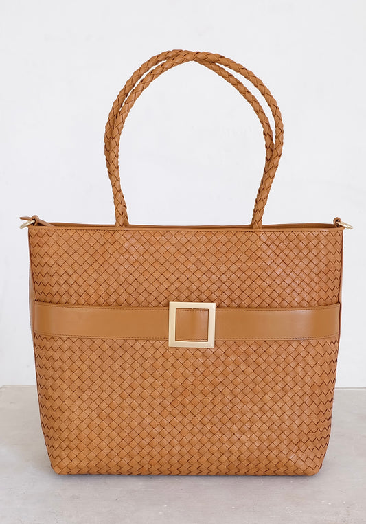 Sustainable Italian leather designer handbag, medium tote and crossbody in cognac brown. Handbag with accent buckle that is a functional work of art.