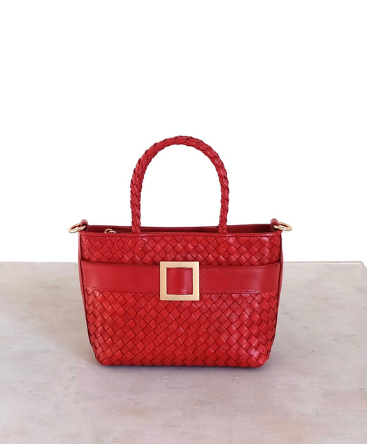 Sustainable Italian leather designer handbag in chili red. Braided mini tote bag and crossbody in one, with accent buckle and front compartment.