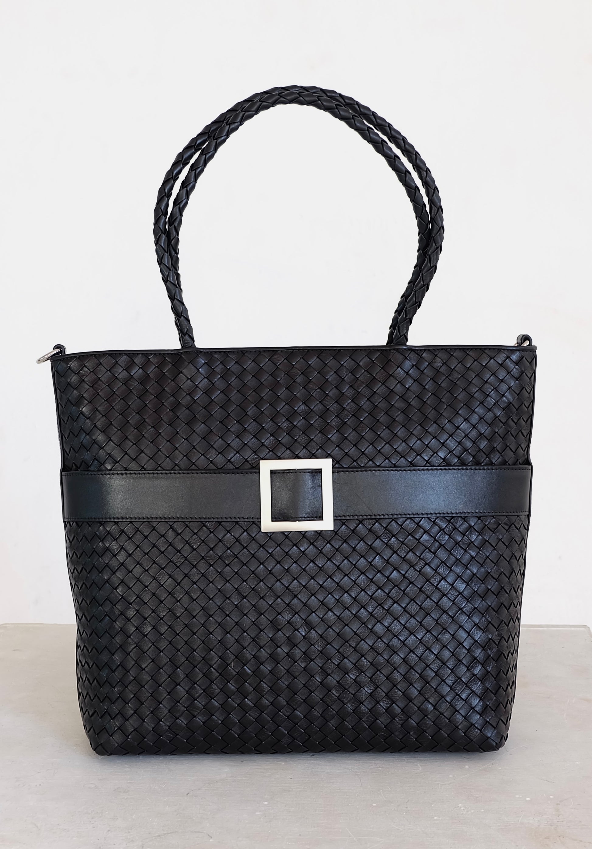 Sustainable Italian leather designer handbag, medium tote and crossbody in charcoal-black. Handbag with accent buckle that is a functional work of art.